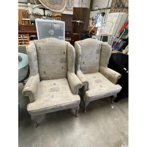 110 - Pair of upholstered wing armchairs 77W (fabric will require cleaning)