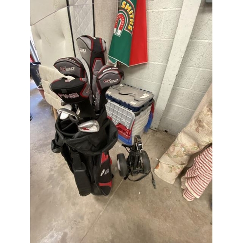 63 - Motocady golf bag and assorted left handed golf clubs including Ping & Wilson