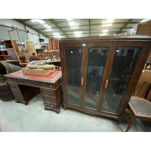 110 - Mahogany pedestal desk with red leather top 76H 122W 60D (as found) and an Art Deco mahogany display... 