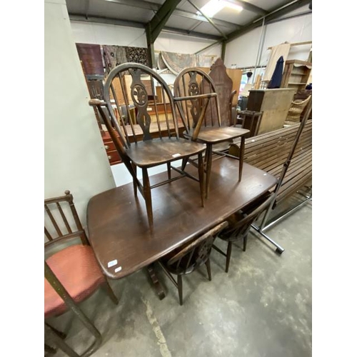 176 - Ercol dining table 72H 153W 76D and 4 Fleur De Lys chairs including 1 carver