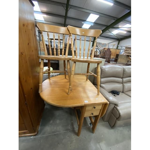 207 - Oak drop leaf table 75H 150W 90D and 2 pine chairs