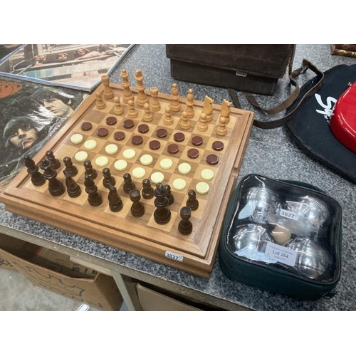 264 - Wooden games box with chess and backgammon and a set of Boules