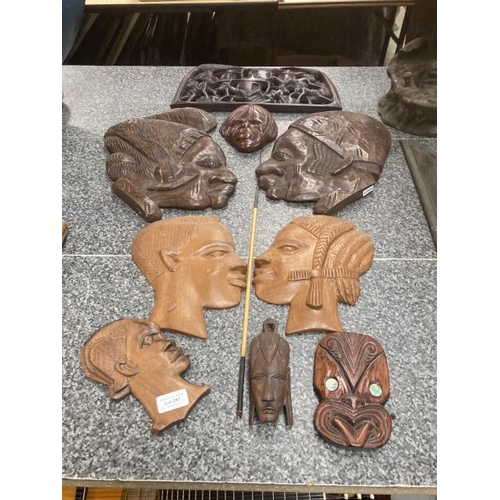 281 - 8 carved tribal face plaques & 1 wall plaque