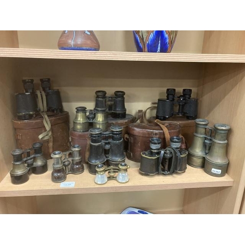 295 - Shelf of binoculars & opera glasses inc. Theatre Field, Ross, London, Wray London, etc.