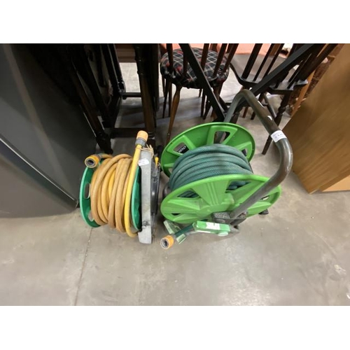 68 - Two garden hose reels