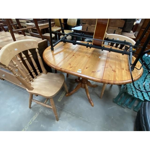 81 - Pine drop leaf table 74H, 122W,90D, and 2 pine chairs