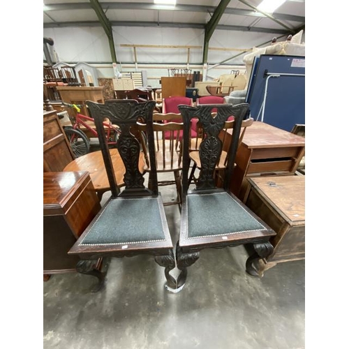 127 - A pair of carved oak side chairs 52W