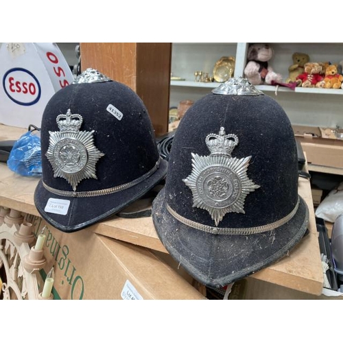 199 - Two British Police Officers helmets