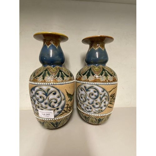 243 - Pair of Doulton Lambeth vases, decorated by Florence Barlow 25cm high