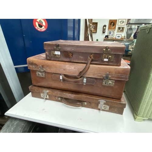 450 - 3 vintage leather travelling cases