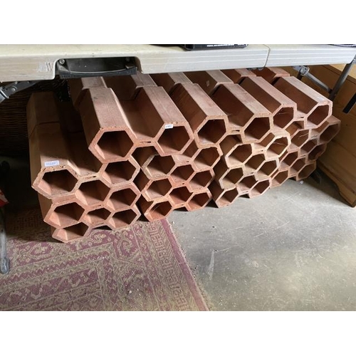 478 - 30x terracotta hexagon 2 hole wine racks