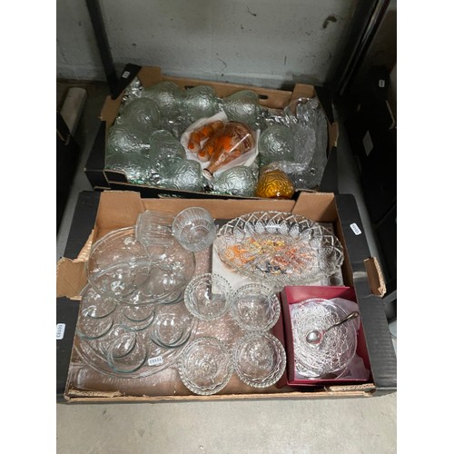 431 - 7 boxes of glassware, Tasco telescope, candelabra, games & toys, glass tea light holders etc.