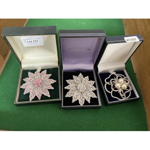 Three large costume brooches