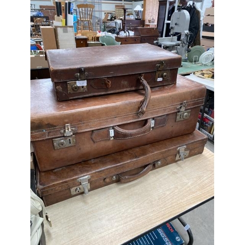 469 - 3 vintage leather travelling cases