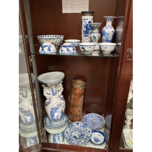 362 - 2 shelves of oriental ceramics inc. Japanese vase, blue & white Chinese plates etc. (some pieces rep... 