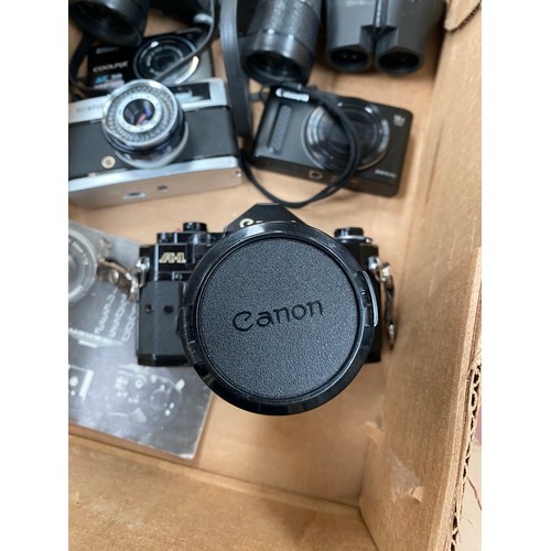 438 - Canon A-1 camera with case & manual, Olympus Trip 35 camera, Canon Powershot SX610HS camera & 2 pair... 