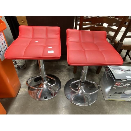 107 - 2 red faux leather and chrome bar stools