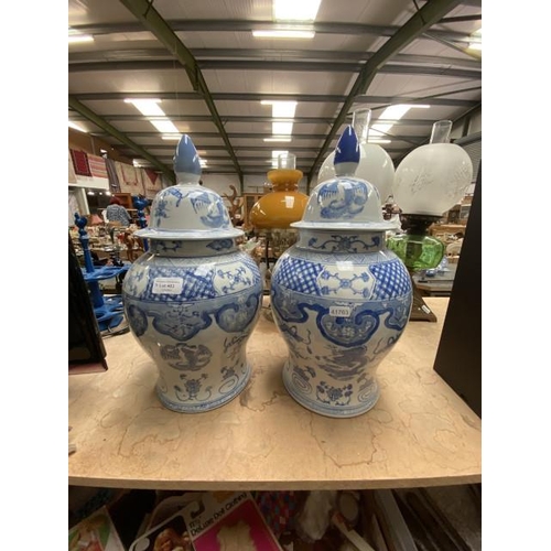 483 - Pair of blue & white vases with covers