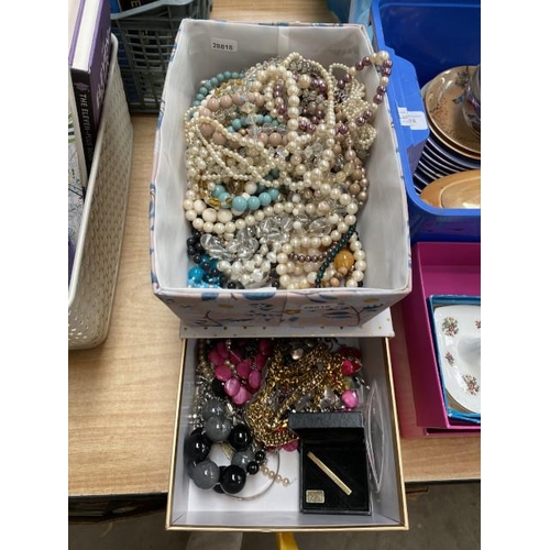 517 - 2 containers of costume jewellery to include, pearl necklaces, beaded necklaces, metal bangle, gold ... 