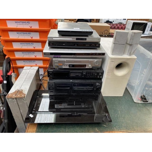 95 - Assorted DVD players, VHS players etc including Sony (all sold as seen) folding picnic table 
Bose l... 