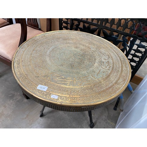 119 - Black iron fire screen and an Oriental brass topped occasional table 58H 60cm diameter