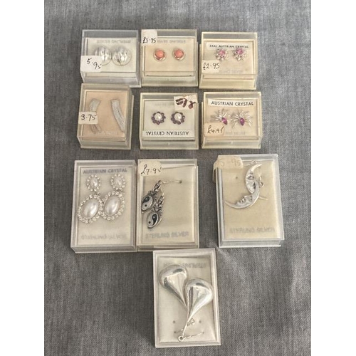 10 pairs of boxed silver earrings