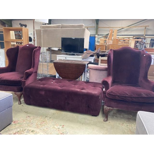 500 - Pair of wine coloured velvet wing armchairs 85W and a button back footstool 40H 140W 75D