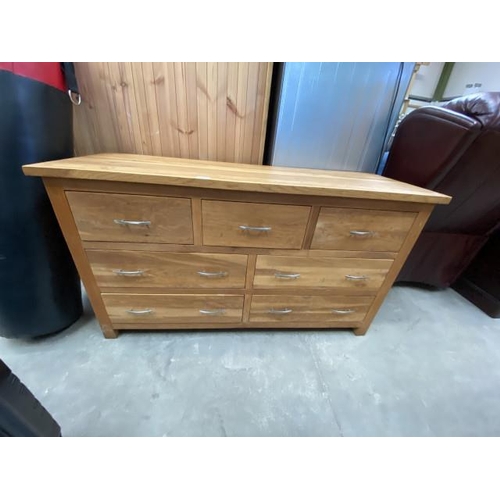 79 - Solid oak multi drawer chest 74H 132W 46D