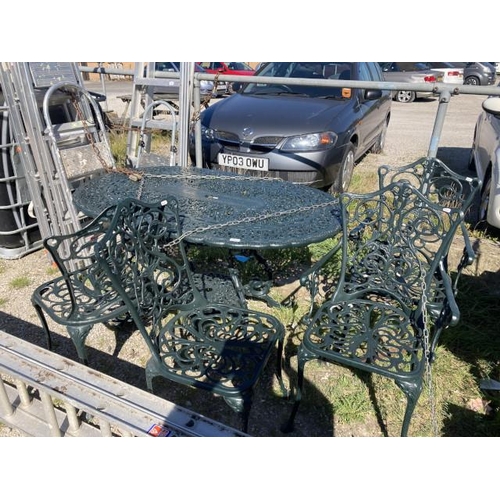 501 - Green painted metal garden table 75H 140W 92D and 4 chairs inc 2 carvers