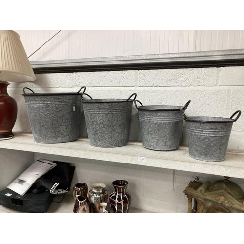 368 - 4 graduated metal planters (Largest 36Diam 28H)
