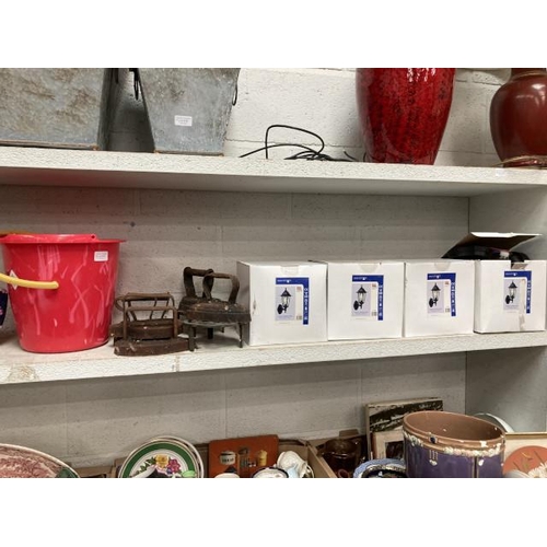 375 - 4 boxed outdoor PIR wall lights, 6 cast flat irons & 2 cast trivets