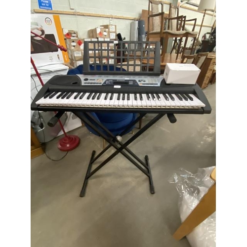 26 - Yamaha EZ-150 keyboard with power pack and stand