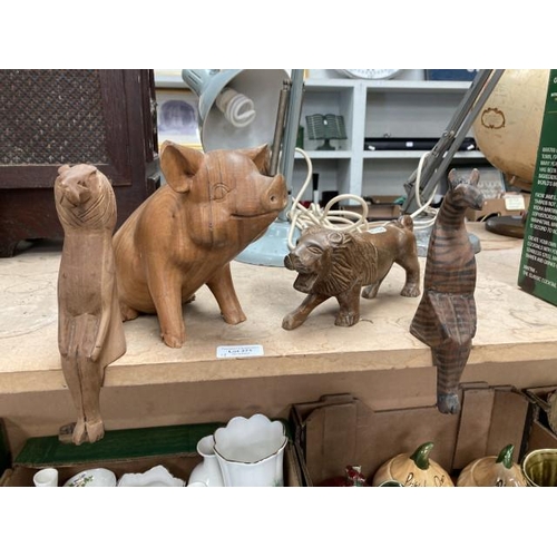371 - 4 treen carved animals (2 Lions, Pig & Zebra)
