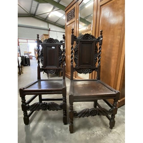 150 - Pair of Gothic carved oak hall chairs 51W