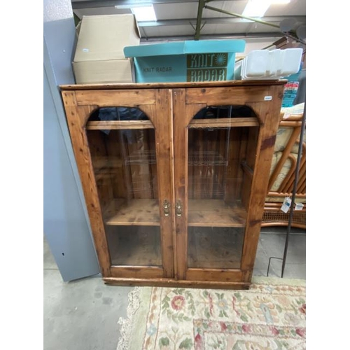 163 - Stained pine glazed bookcase 107H 82W 30D