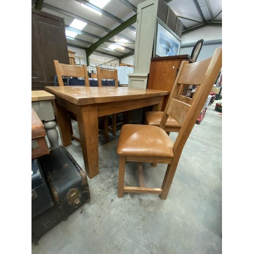 182 - Solid oak extending table 79H 140-180W 90D and 4 chairs