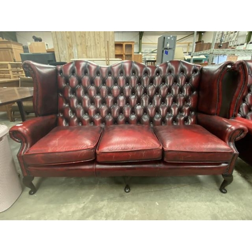 191 - Ox blood leather button back Chesterfield wing settee 180W