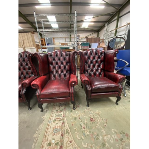 192 - Pair of Ox blood leather button back Chesterfield wing armchairs 56W