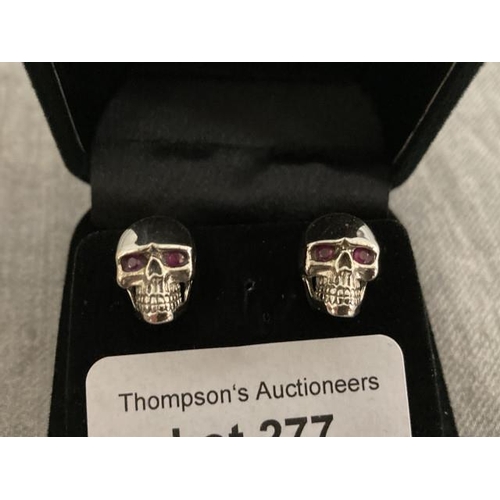 277 - Pair of silver stone set skull earrings