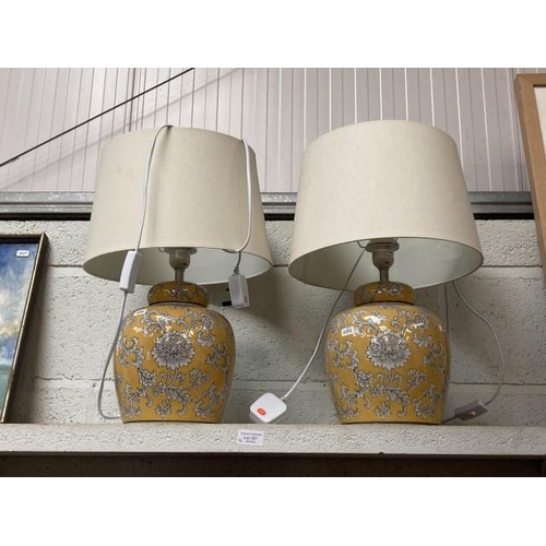 301 - Pair of ceramic mustard coloured floral table lamps with shades 50H