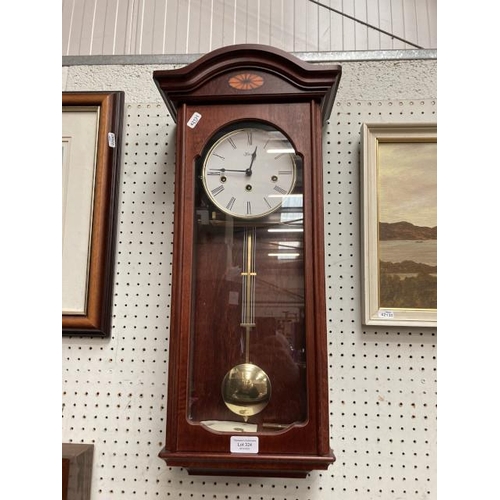 324 - Hermle mahogany cased wall clock with pendulum & key