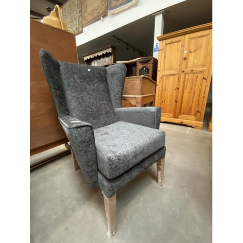 55 - Grey upholstered wing armchair 70W