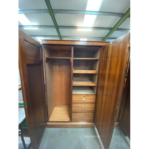 149 - E Shaw & Son Cabinet Makers, Bradford triple wardrobe with fitted interior 205H 184W 56D