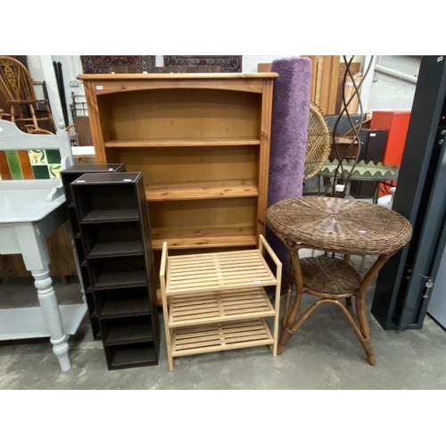 88 - Pine bookcase 128H 87W 29D, 2 CD stands 87H 22W 16D, wicker table 65H 61cm diameter etc