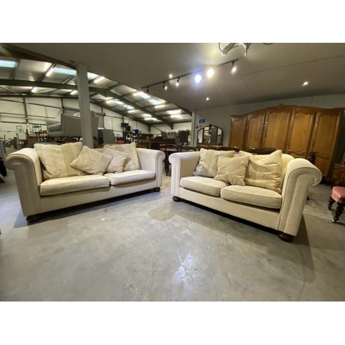 111 - 2 cream settees with scatter cushions 168W & 195W