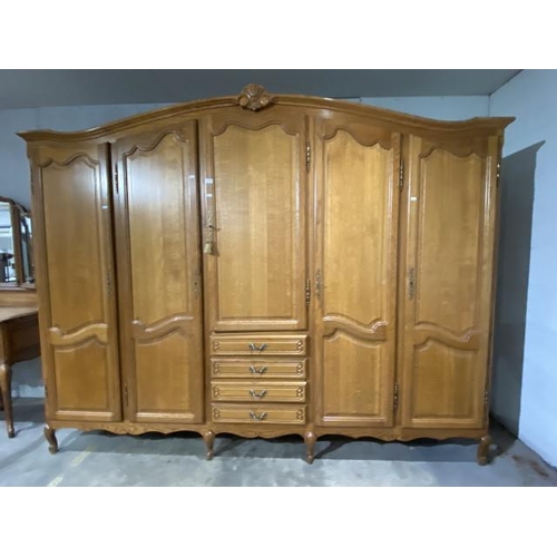 122 - French oak 5 door/4 drawer armoire with hanging rails and shelves to the interior 205H 260W 60D