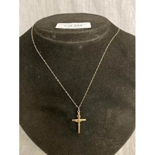 244 - 9ct gold Inri on the cross and a 9ct gold chain (1g)