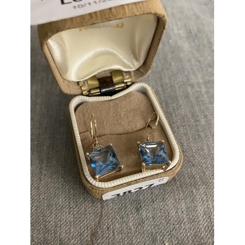 284 - 9ct gold, diamond and blue topaz earrings