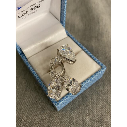 306 - Dress ring (size O) and matching earrings (possibly silver)