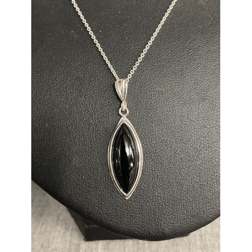 329 - Silver & jet pendant on a silver chain